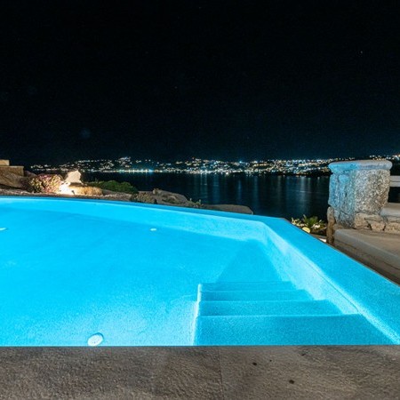 the pool lights of the property at night