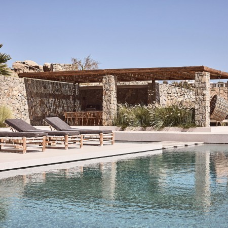 the pool and sun beds at villa La Roche