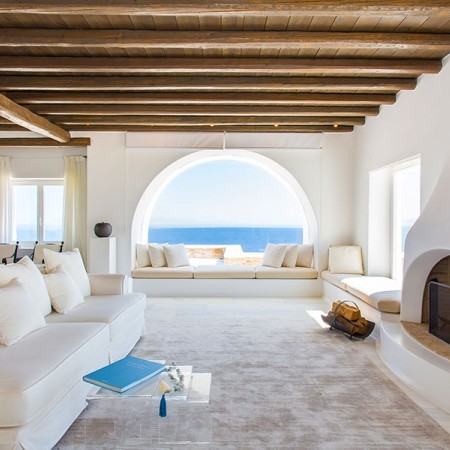 living room with sea view and fireplace