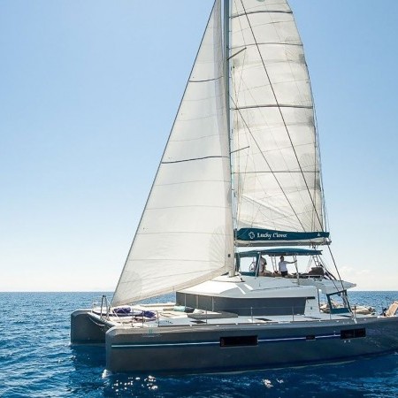 Lucky Clover sailing catamaran while cruising