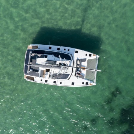 aerial photo ot mykonos catamaran for rent