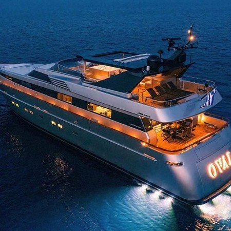 Oval superyacht at night