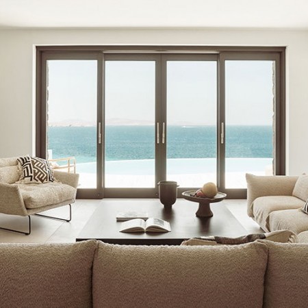 living room with glass windows and sea view